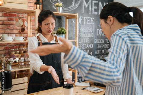 A Customer Approaches A Store Associate Annoyed