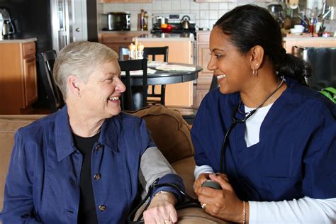 Paula A Home Health Aide Is Helping A Patient